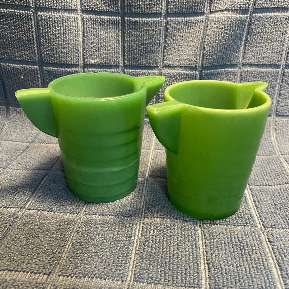 Two Green Akro Agate Cream Pitchers. 2 styles. Art Deco